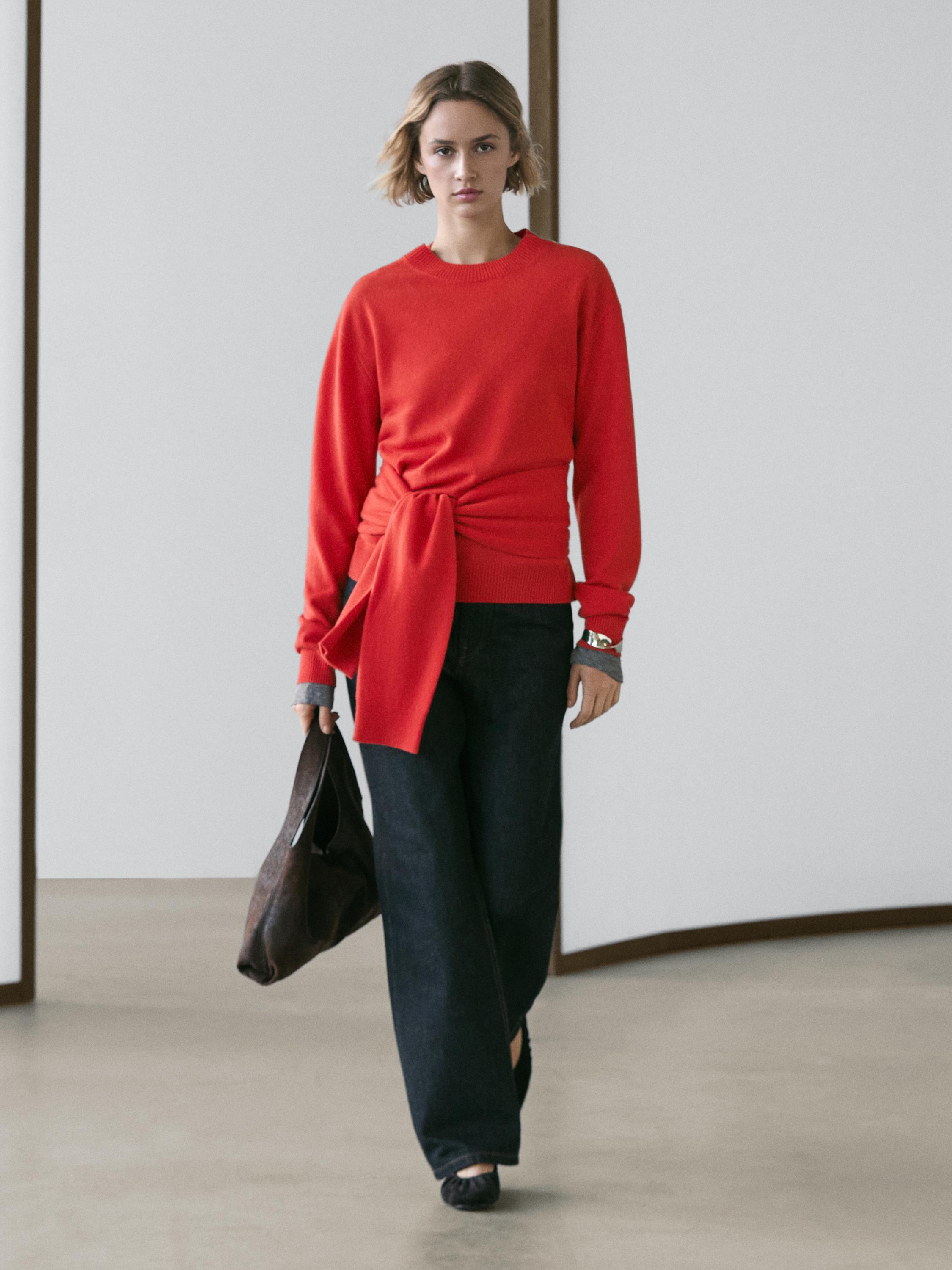 Wool knit sweater with waist detail